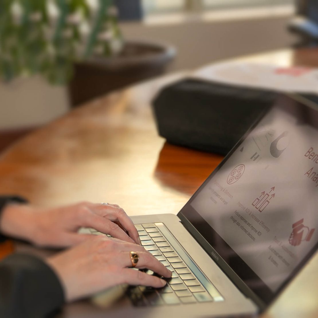 Hands on a laptop keyboard