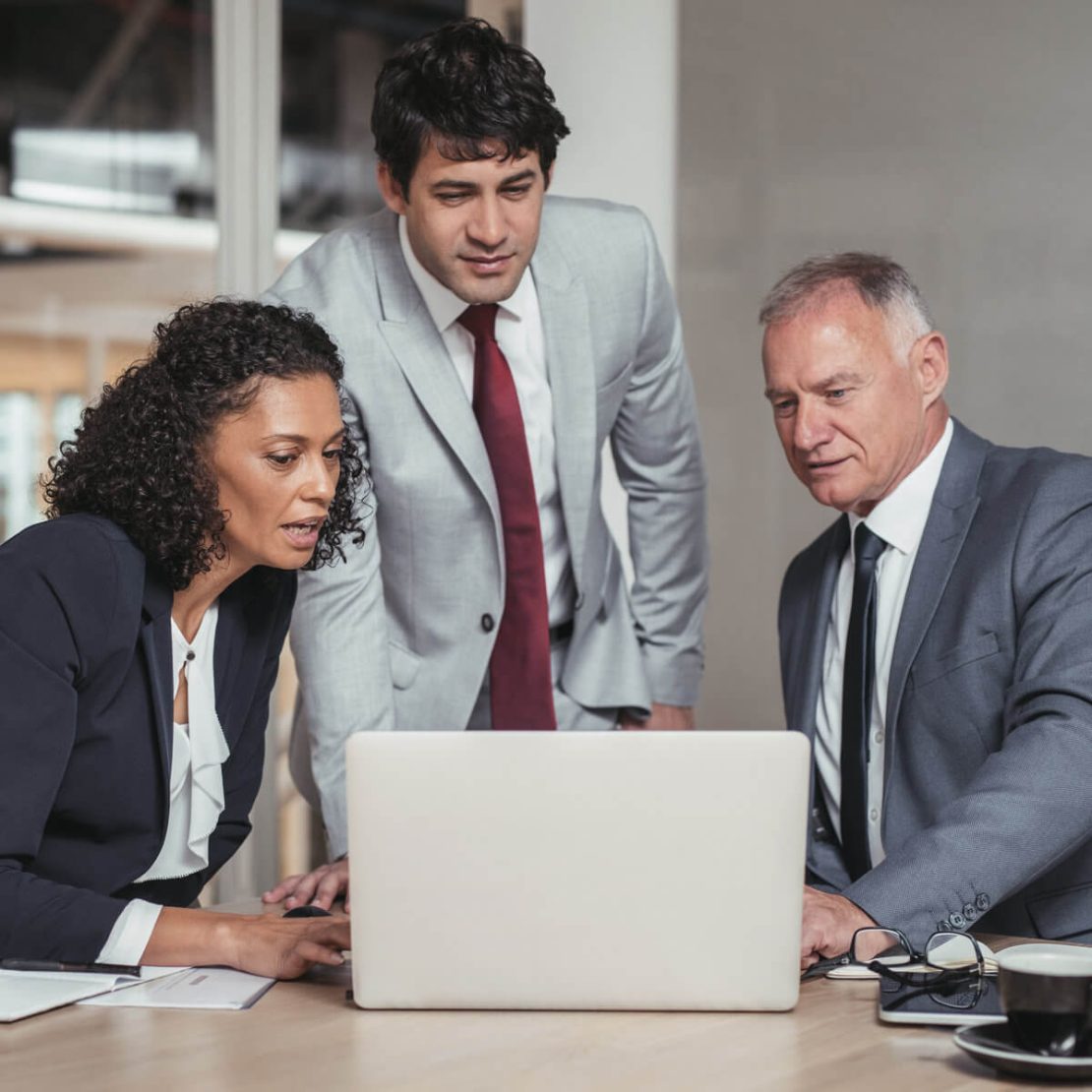 businesspeople working in office boardroom