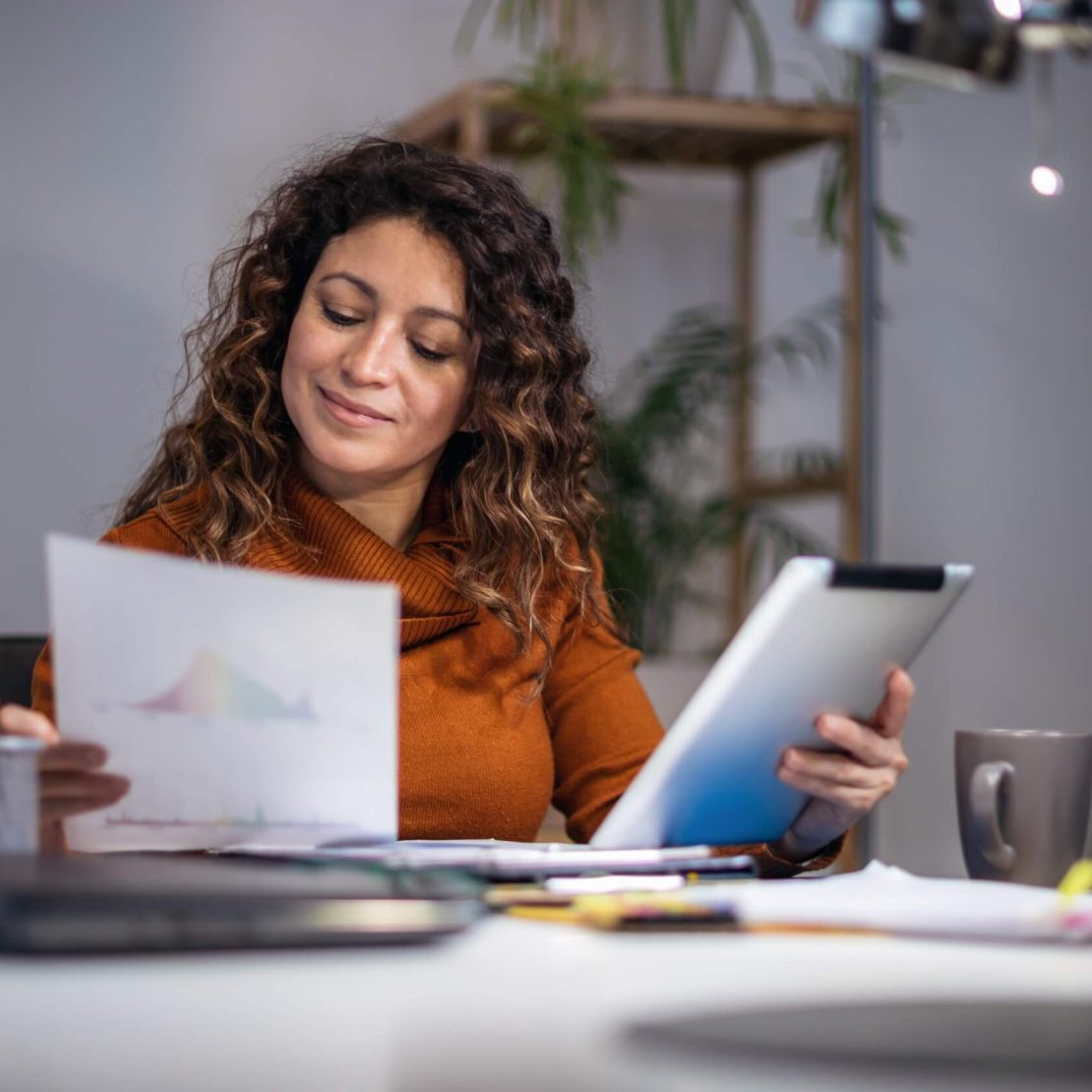 Woman working on a tablet in an office